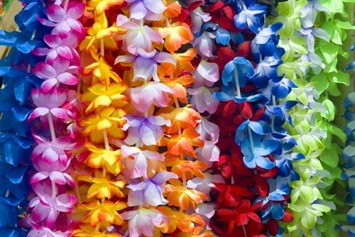 Providing leis for your guests to wear will help to set the scene for a tropical wedding.